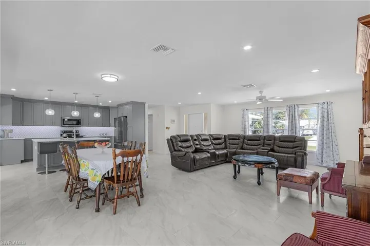 Dining area featuring ceiling fan, visible vents, and recessed lighting
