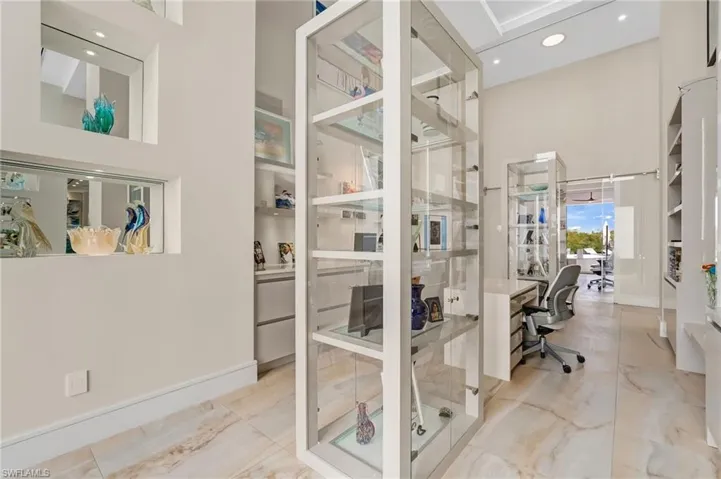 This versatile space is currently envisioned as an art gallery and private retreat, yet offers endless possibilities—ideal for an additional office, cozy seating area, or an elegant reading room tailored to your lifestyle.