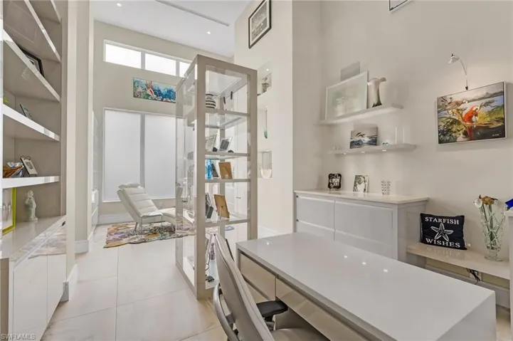This versatile space is currently envisioned as an art gallery and private retreat, yet offers endless possibilities—ideal for an additional office, cozy seating area, or an elegant reading room tailored to your lifestyle.