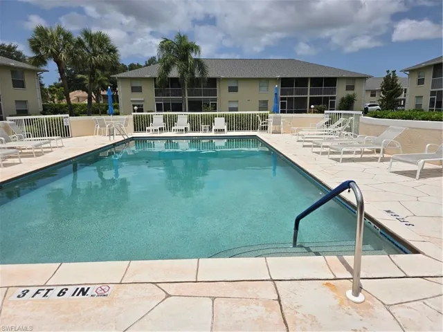 Community pool with a patio area