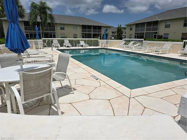 Community pool featuring a patio