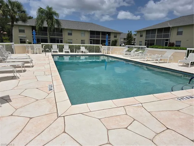 Community pool featuring a patio