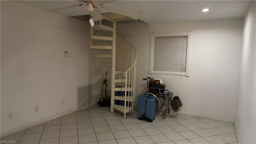 Living room Quonset with steps to upstairs 2 bedrooms and full bathroo