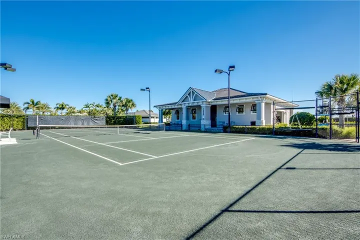 View of tennis court featuring community basketball court