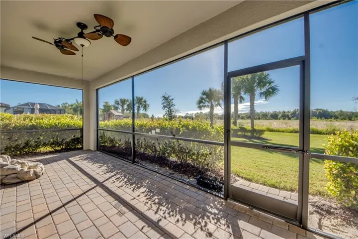 Unfurnished sunroom featuring a ceiling fan and healthy amount of natural light