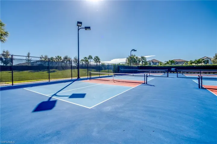 View of tennis court featuring community basketball court