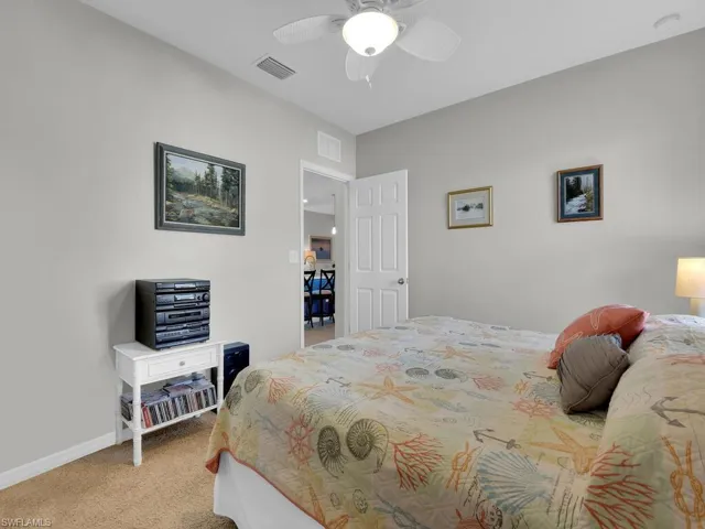 Bedroom featuring carpet flooring and ceiling fan