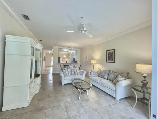 Tiled Living Room with crown molding