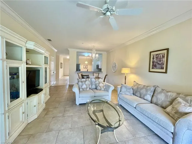Living Room with large tiles and crown molding