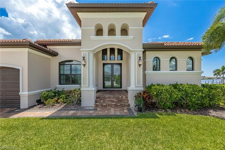 Doorway to property with a yard