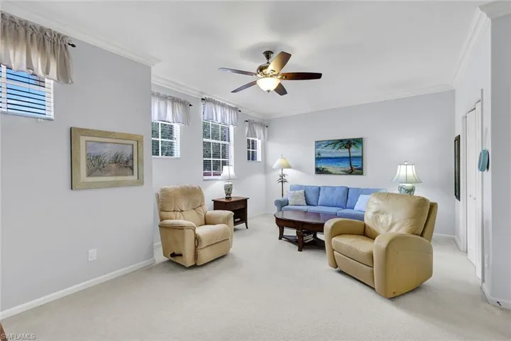Guest bedroom #1 with wonderful space, ceiling fan/light, and lovely windows and natural light!
