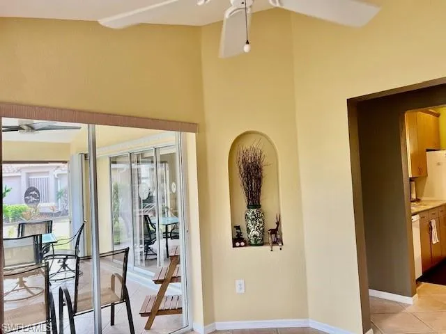 Hallway featuring light tile patterned flooring