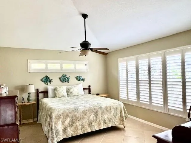 Tiled bedroom with ceiling fan