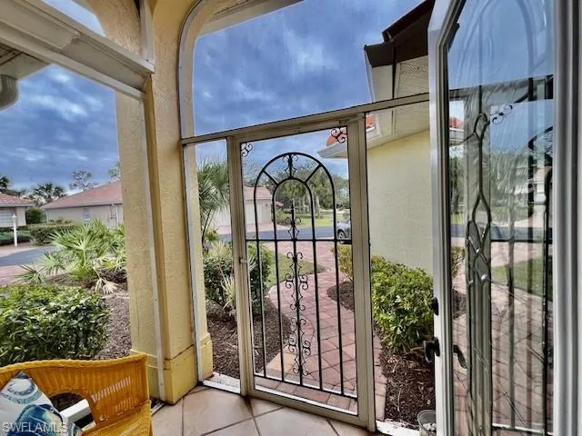 Entryway with light tile patterned floors