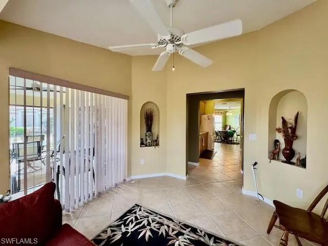Hallway featuring light tile patterned flooring