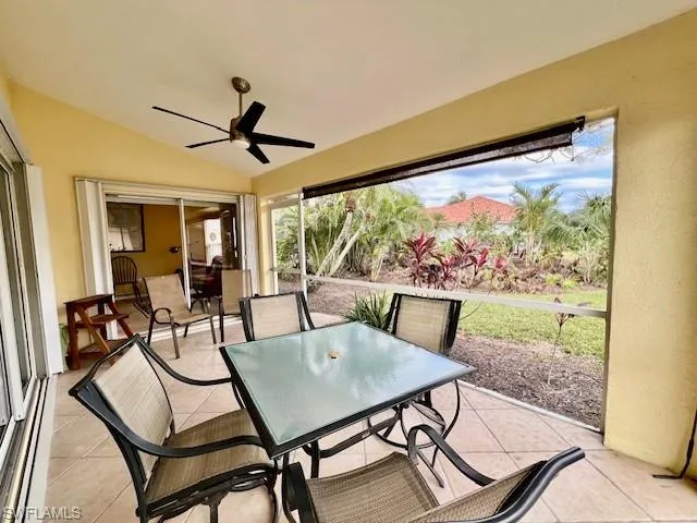Sunroom featuring ceiling fan and vaulted ceiling