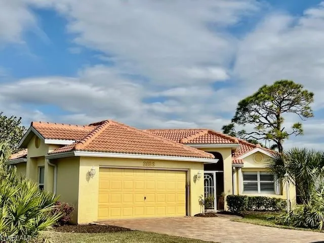 Mediterranean / spanish-style house featuring a garage