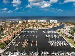Bird's eye view of numerous boat docks and a large body of water
