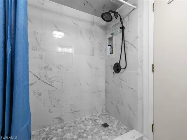 Bathroom with curtained shower