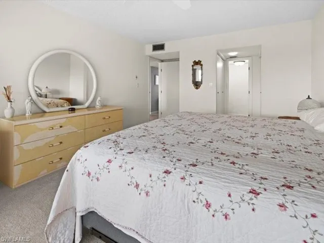 Bedroom with light carpet