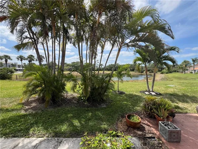 View of yard with a water view
