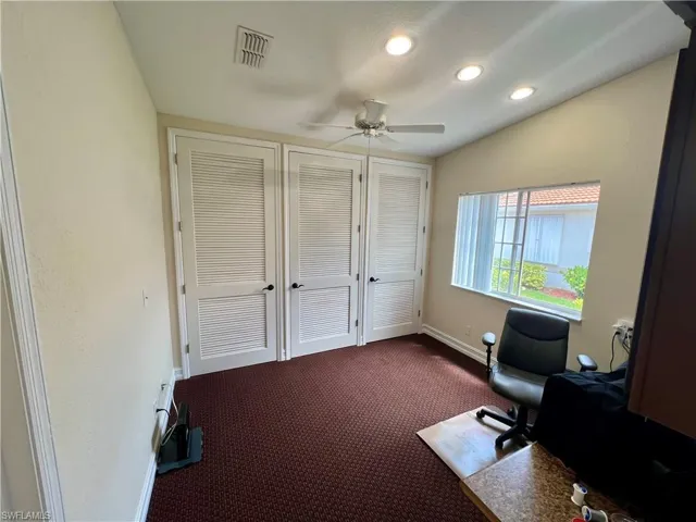 Home office with baseboards, visible vents, recessed lighting, a ceiling fan, and dark carpet