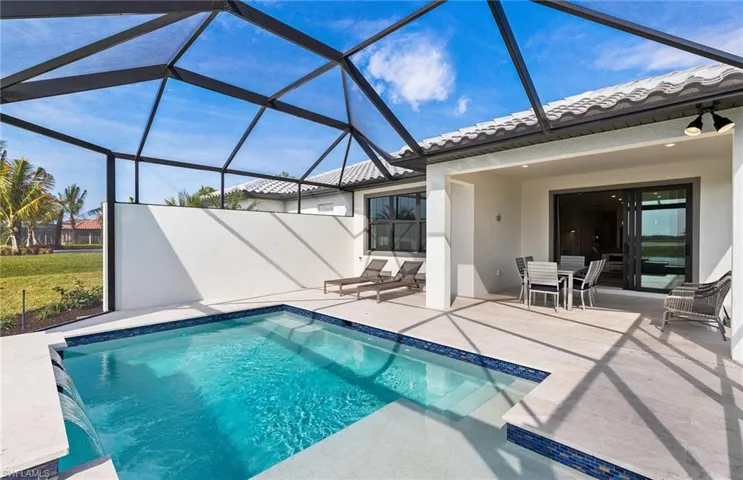 Covered lanai with custom pool - southern facing lanai on Lake Como