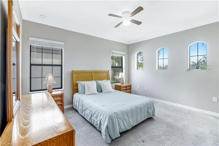 Primary Bedroom with crown molding, and ceiling fan with ensuite bathroom and large walk-in closet
