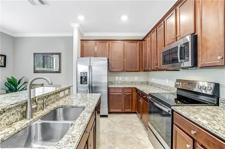 Kitchen featuring stainless steel appliances and granite countertops