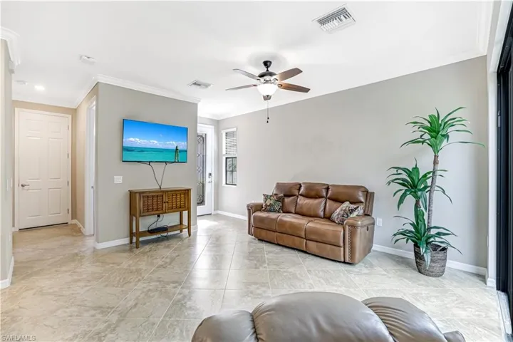 Livong room with easy access to half bath and garage