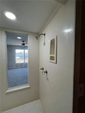 Bathroom featuring ornamental molding