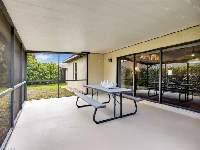 Unfurnished sunroom with outdoor dining area
