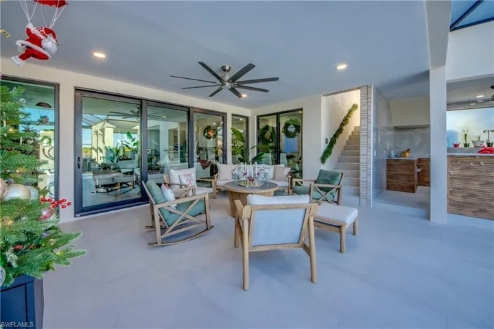 View of patio / terrace featuring a ceiling fan and an outdoor living space