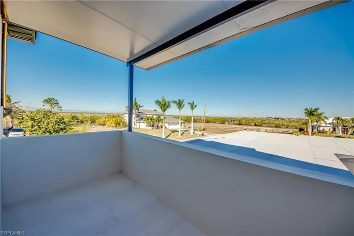 Balcony featuring a sunroom