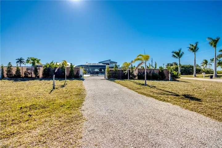 View of front of property with a gate