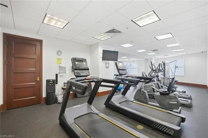 Workout area featuring a paneled ceiling