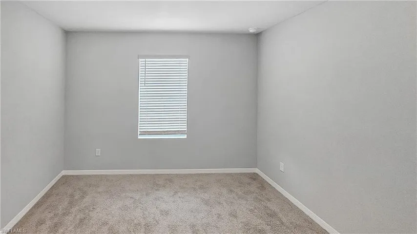 Unfurnished room featuring carpet