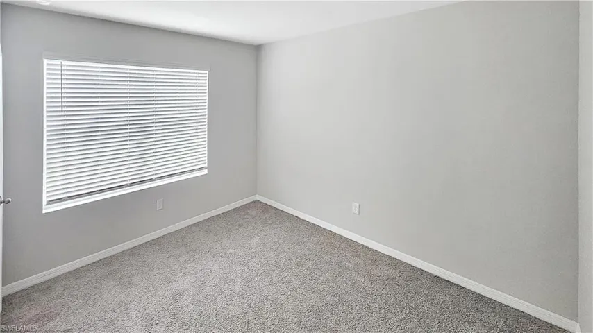 Spare room with carpet flooring