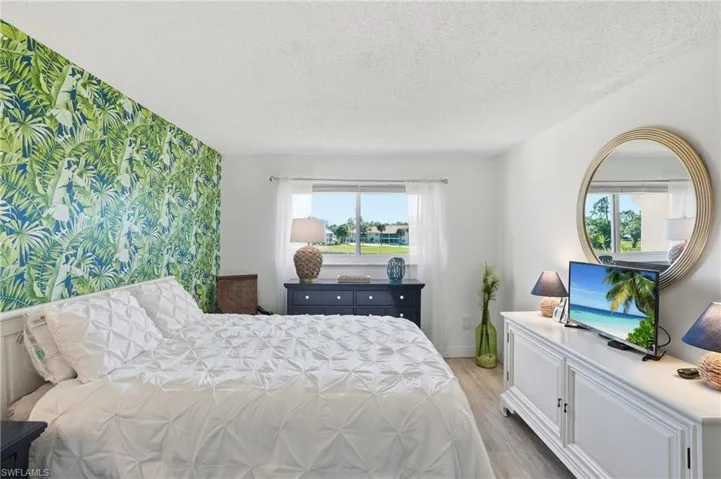 PRIMARY BEDROOM SUITE WITH UPDATED WINDOW..