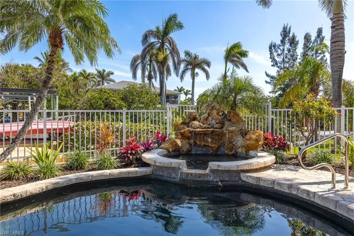 View of swimming pool with fence