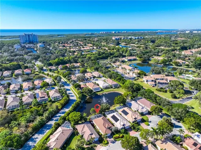 View of property location with a nearby body of water and nearby suburban area