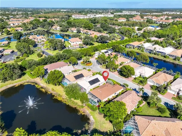 Aerial overview of property's location with a large body of water and nearby suburban area