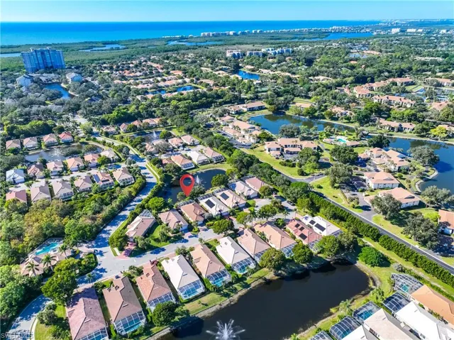 View of property location with a large body of water and nearby suburban area