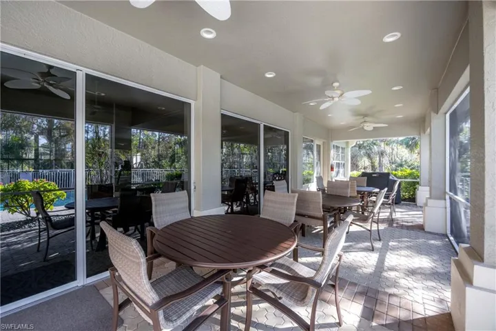 Clubhouse Lanai with ceiling fan, outdoor dining space, and a patio area