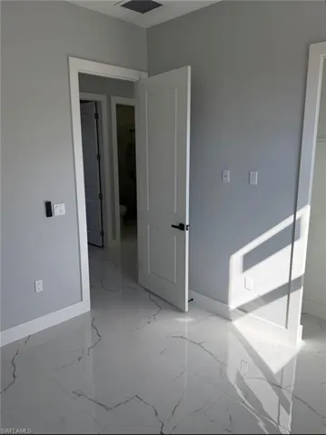 Empty room with light marble finish flooring