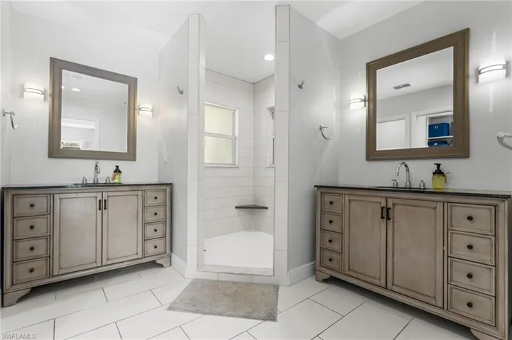 Master bathroom with dual vanity areas