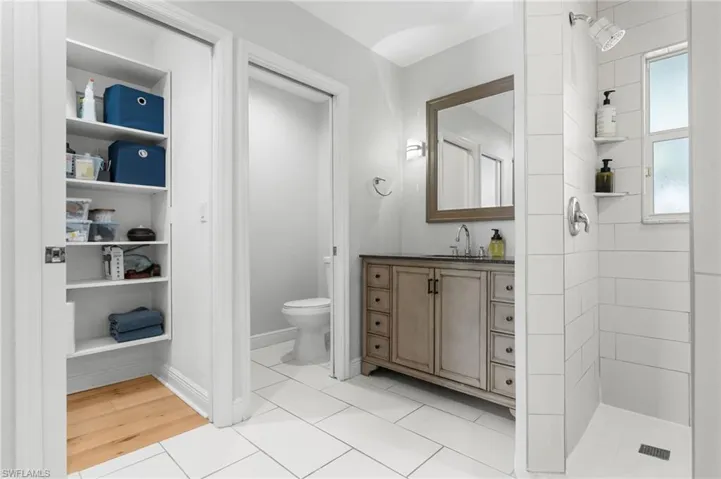 A private toilet area, and built-in shelving