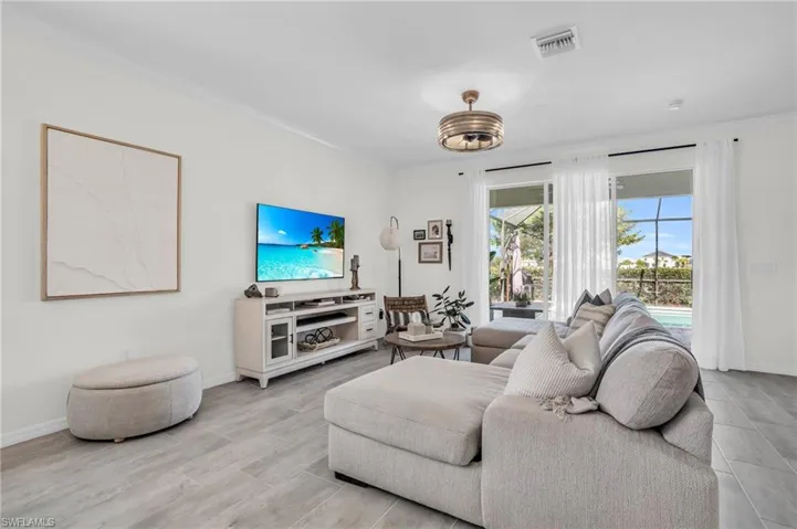 Living room featuring crown molding