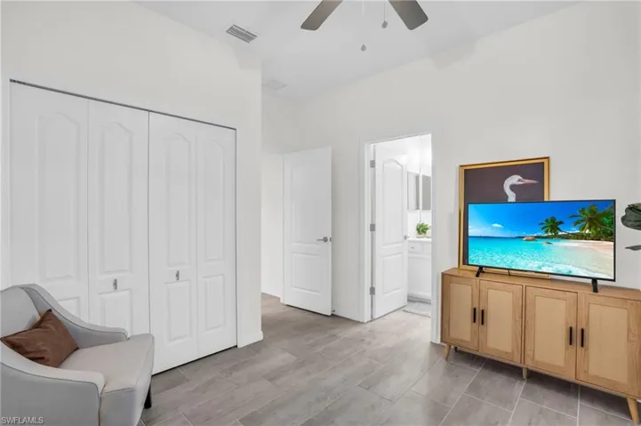 Guest room featuring ceiling fan and light hardwood / wood-style floors
