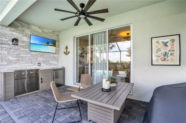 View of patio / terrace with an outdoor kitchen and ceiling fan